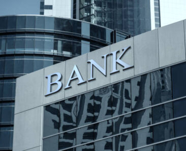 Bank sign on glass wall of business center