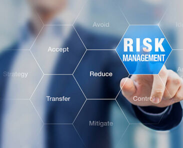 Businessman pointing at risk management concept on screen